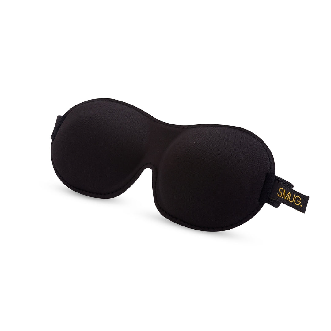Black SMUG contoured sleep mask with shaped eye cups and an adjustable strap.